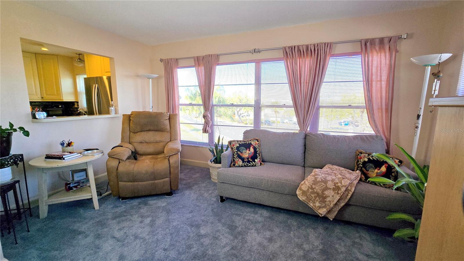 Den/Family Room with a pass through space to the kitchen, great to not miss out on the conversations