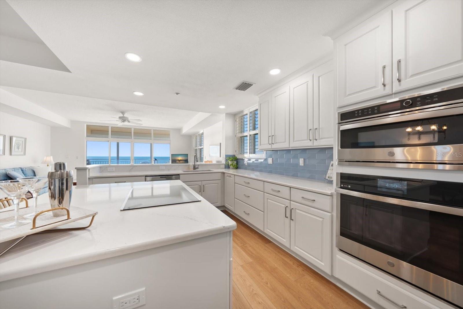 Providing an open-concept, the floor plan flows effortlessly into living areas-no one ever misses the sunsets!