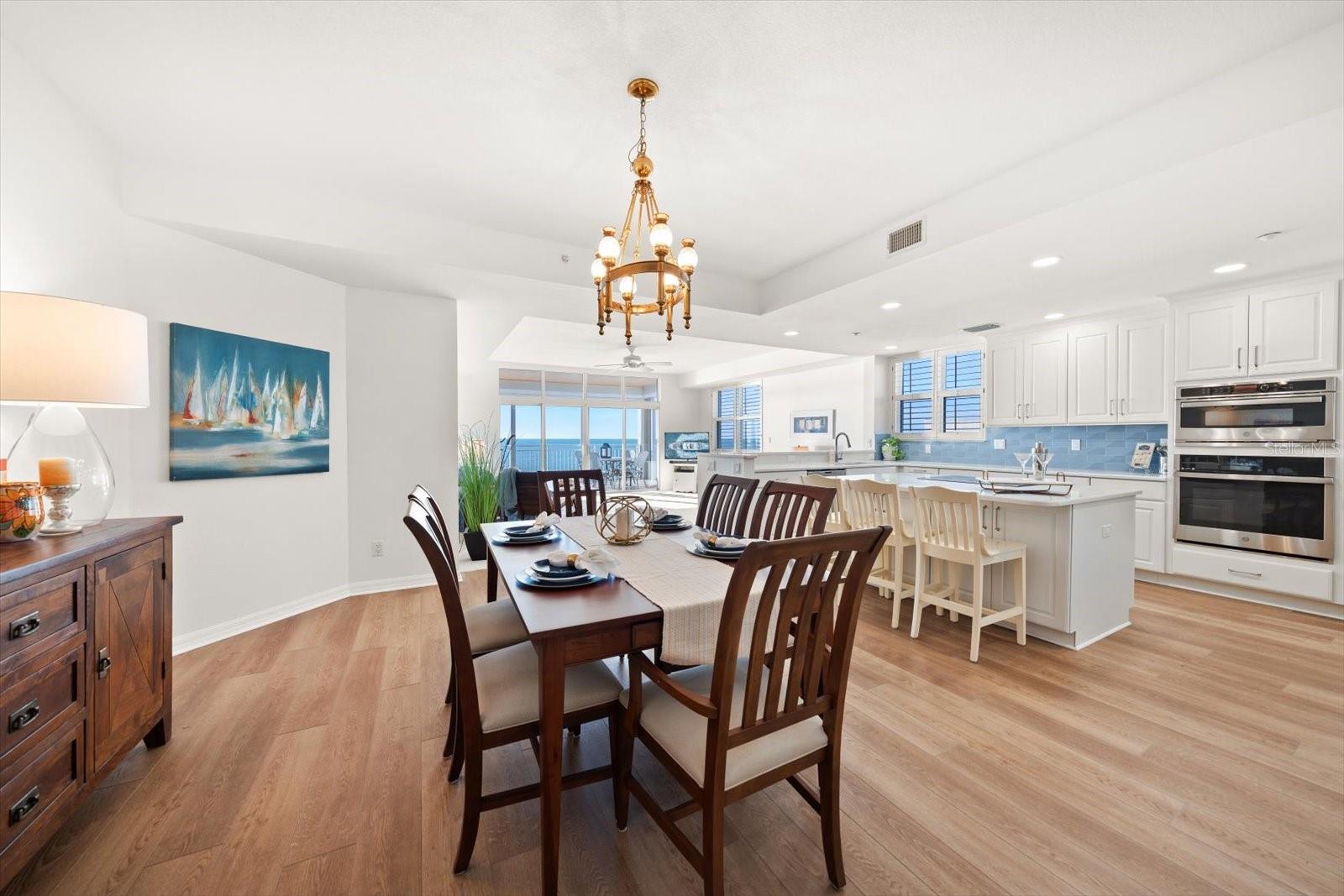 Dining area  is expansive in this corner unit of spaciousness and natural light.