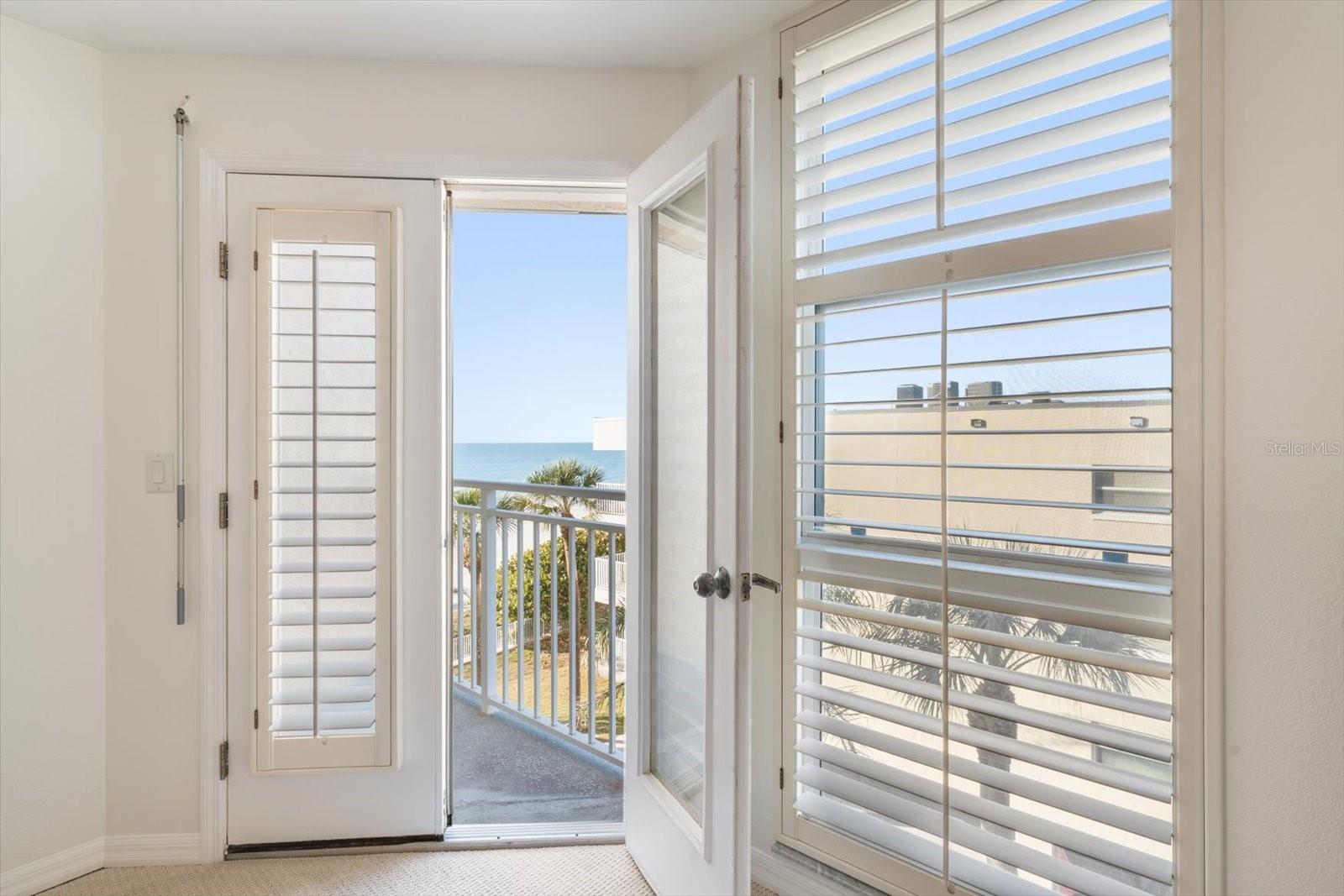 Primary bedroom has terrace overlooking beach and Gulf.