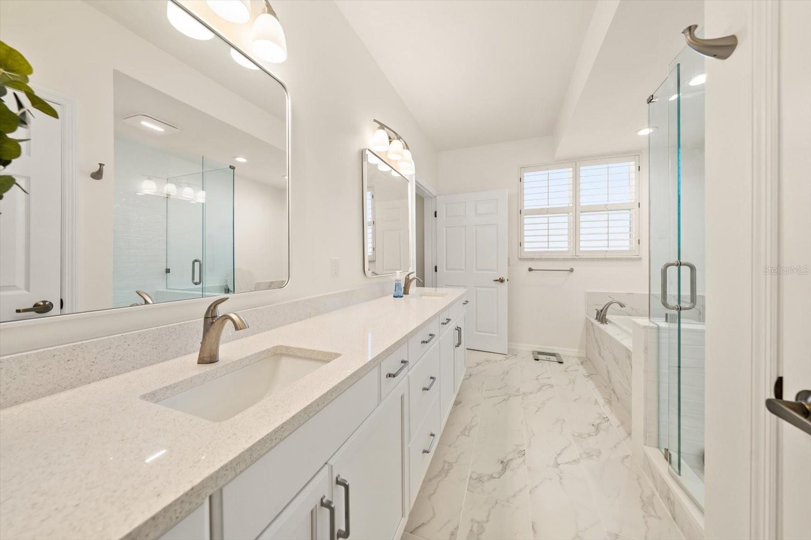 Dual vanities and lots of counter space, the bath area is impressive!