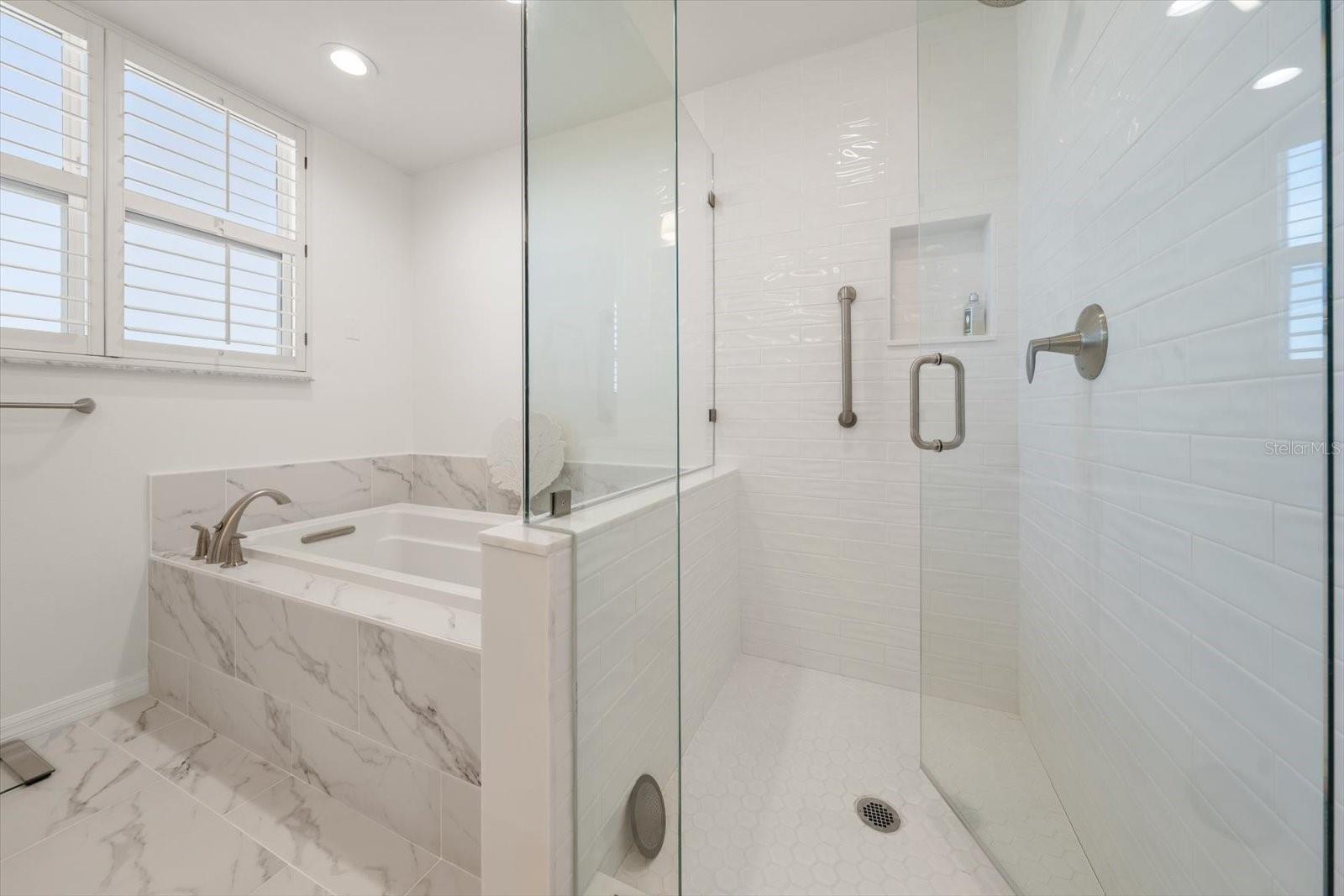 Walk in shower in primary suite.