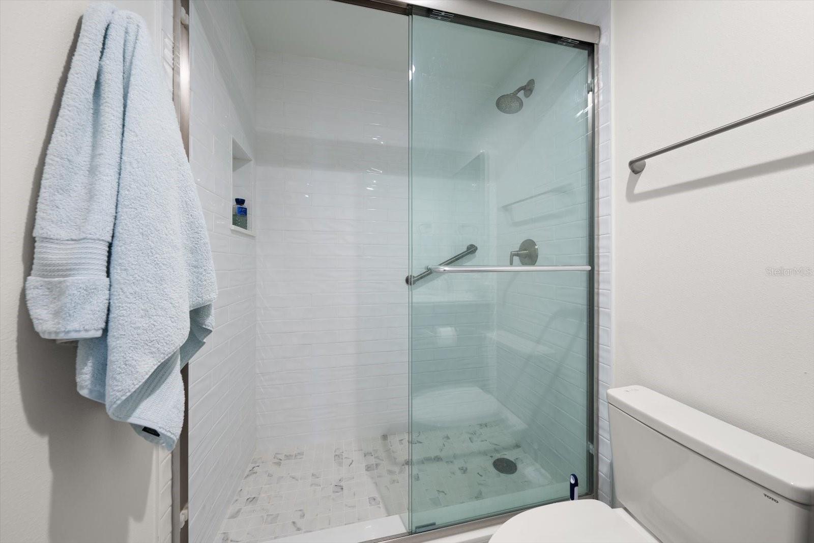 Walk in shower in second /guest bedroom area.