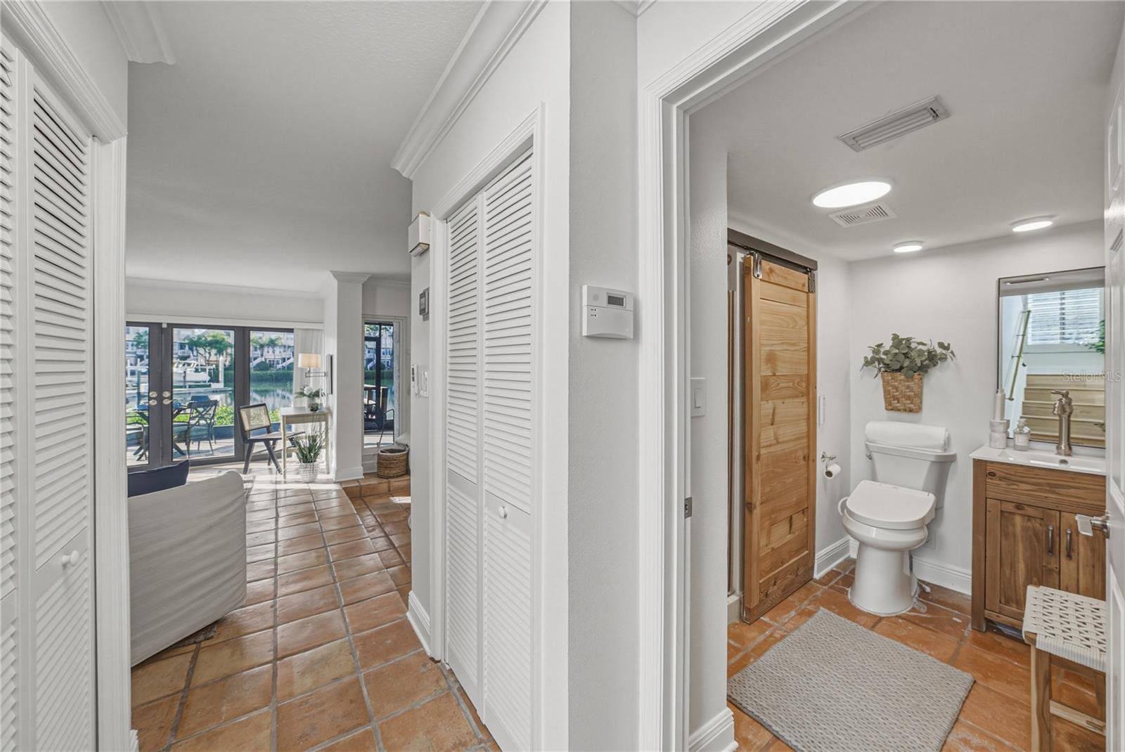 Hall with Under Stairs Storage and Hall Closet