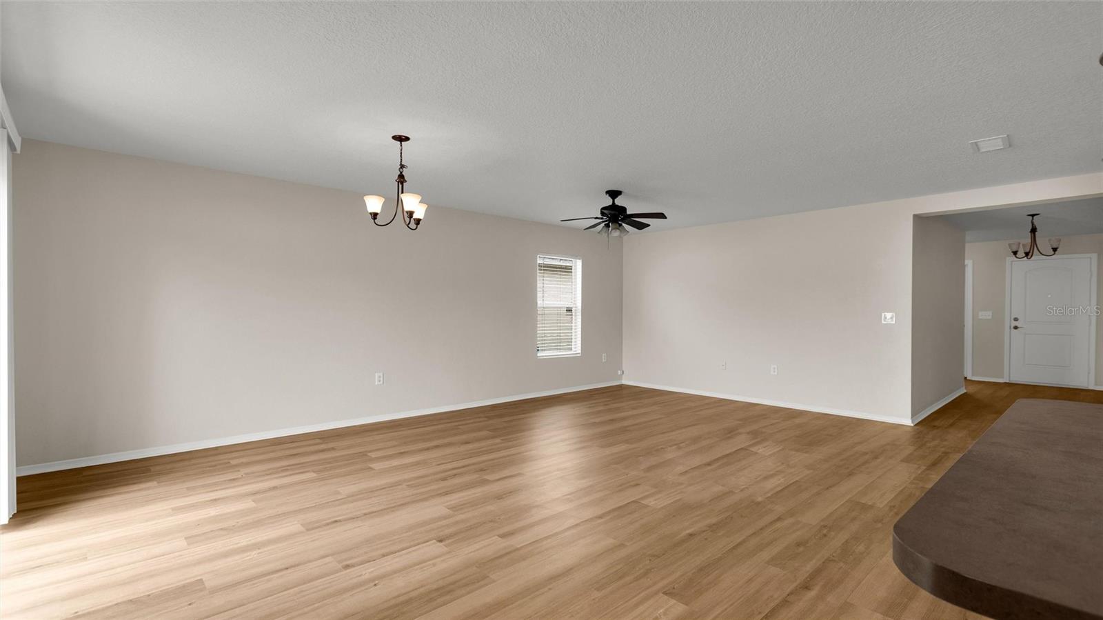 Reverse view of great room looking back to front door entrance.