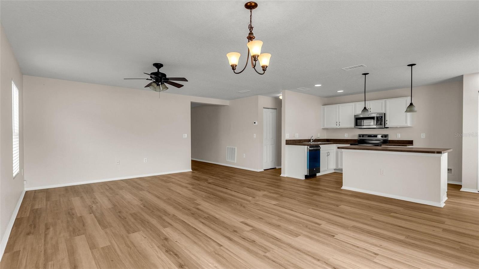 Reverse view of kitchen.  Primary bedroom suite is located behind the kitchen.