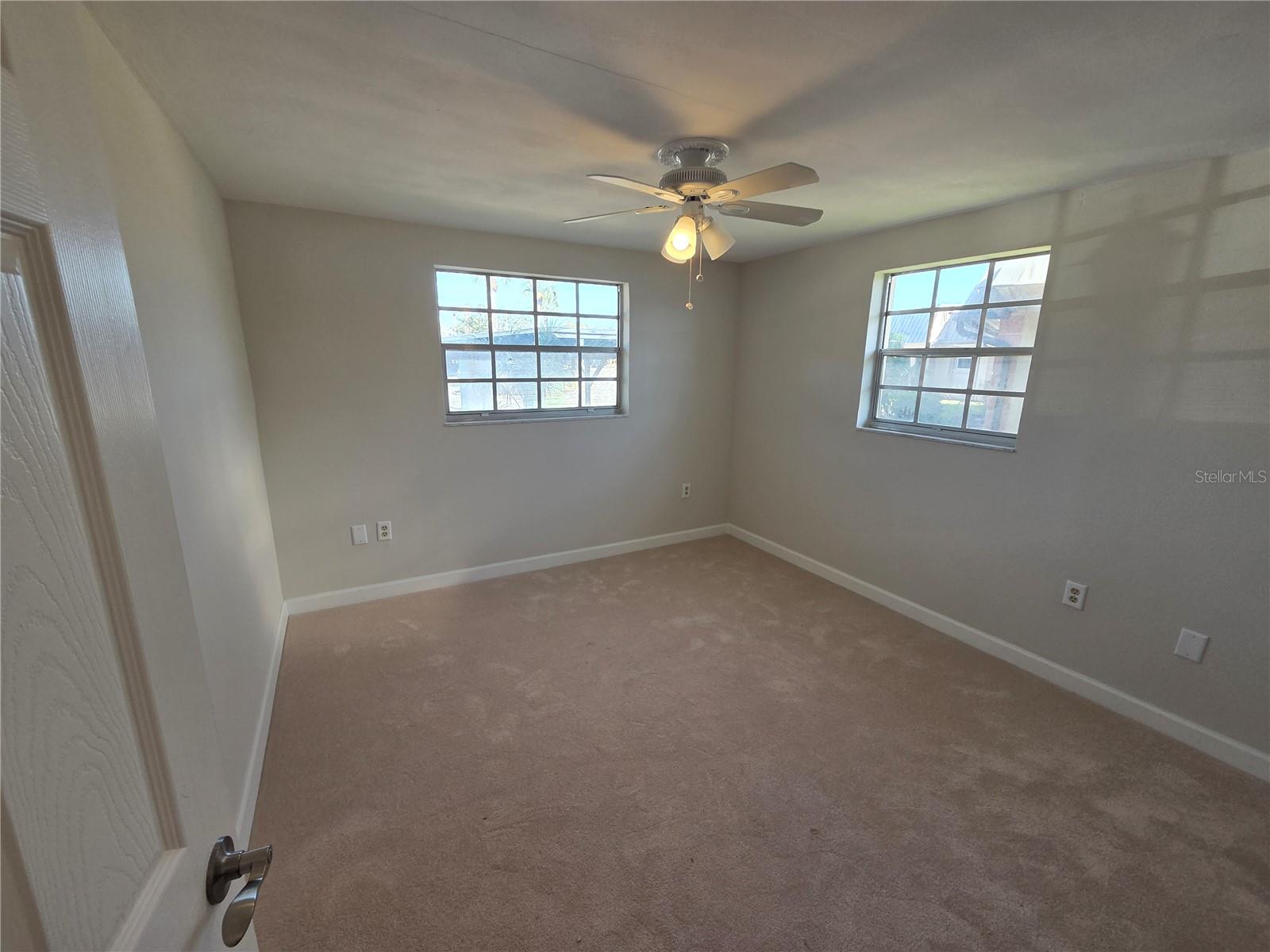 Guest Bedroom with brand new carpet.