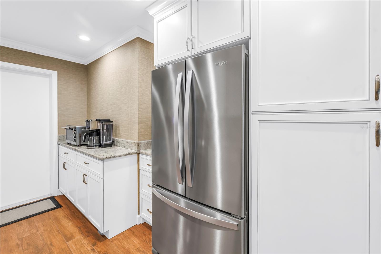 Coffee Bar, Neatly Enclosed Stainless Fridge with Lots of Storage Surround