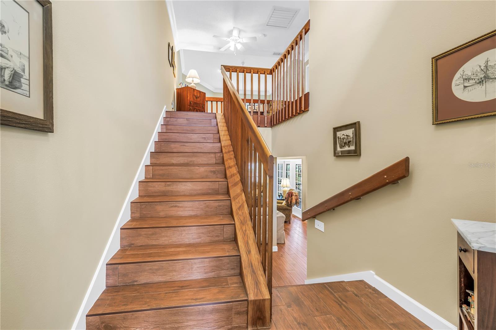 Finely Crafted Staircase with strong Bannister and Rich Wood Grain Color.
