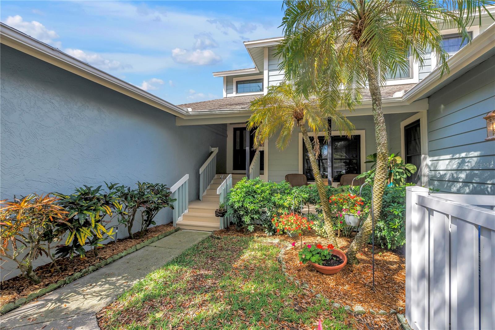 Lush Private Entry to this Townhome.  Great Setback for the Front Porch Oasis