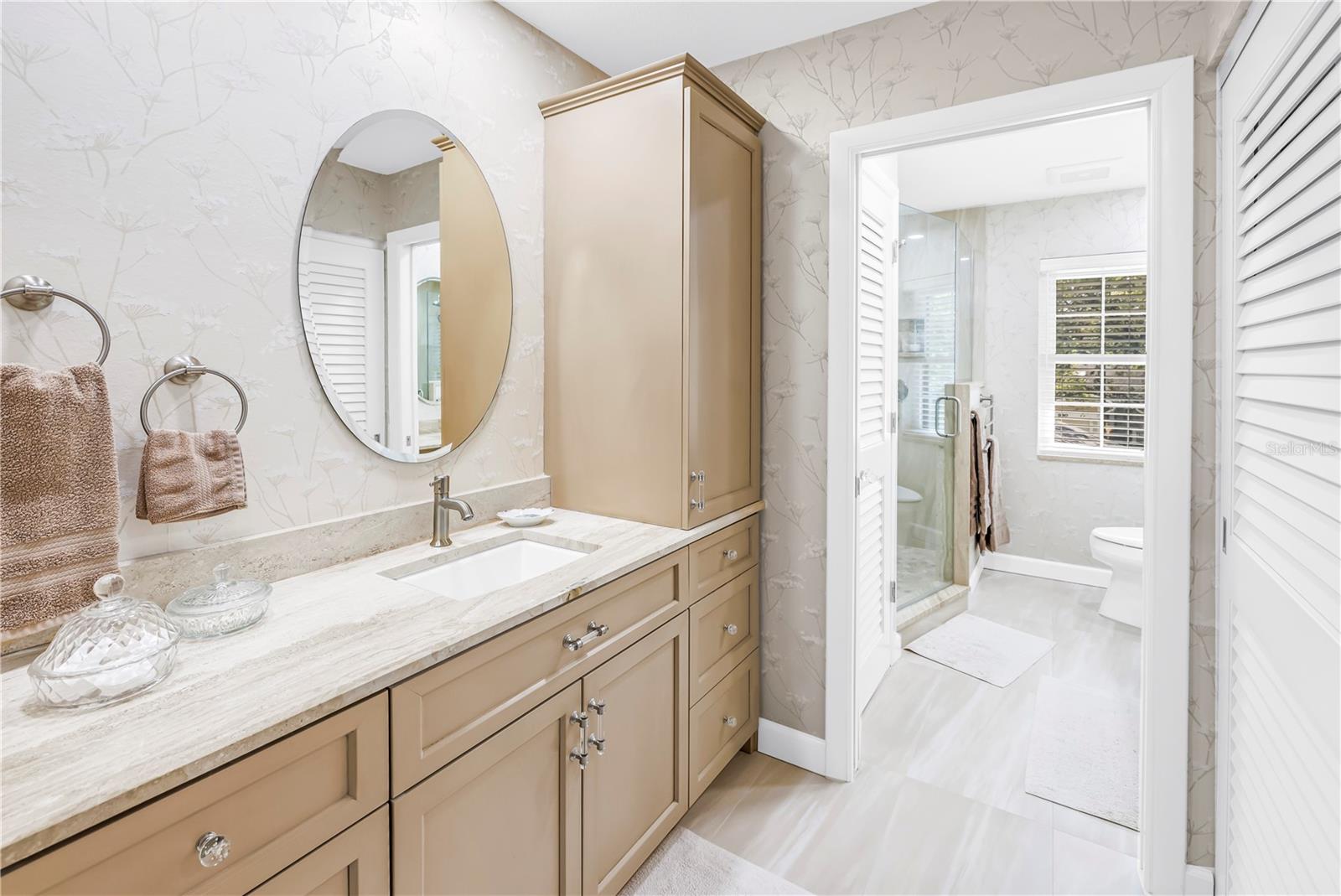 Primary Suite Bath with Marble Counters, Porcelain Floor Tile and Elegant Wall Covering