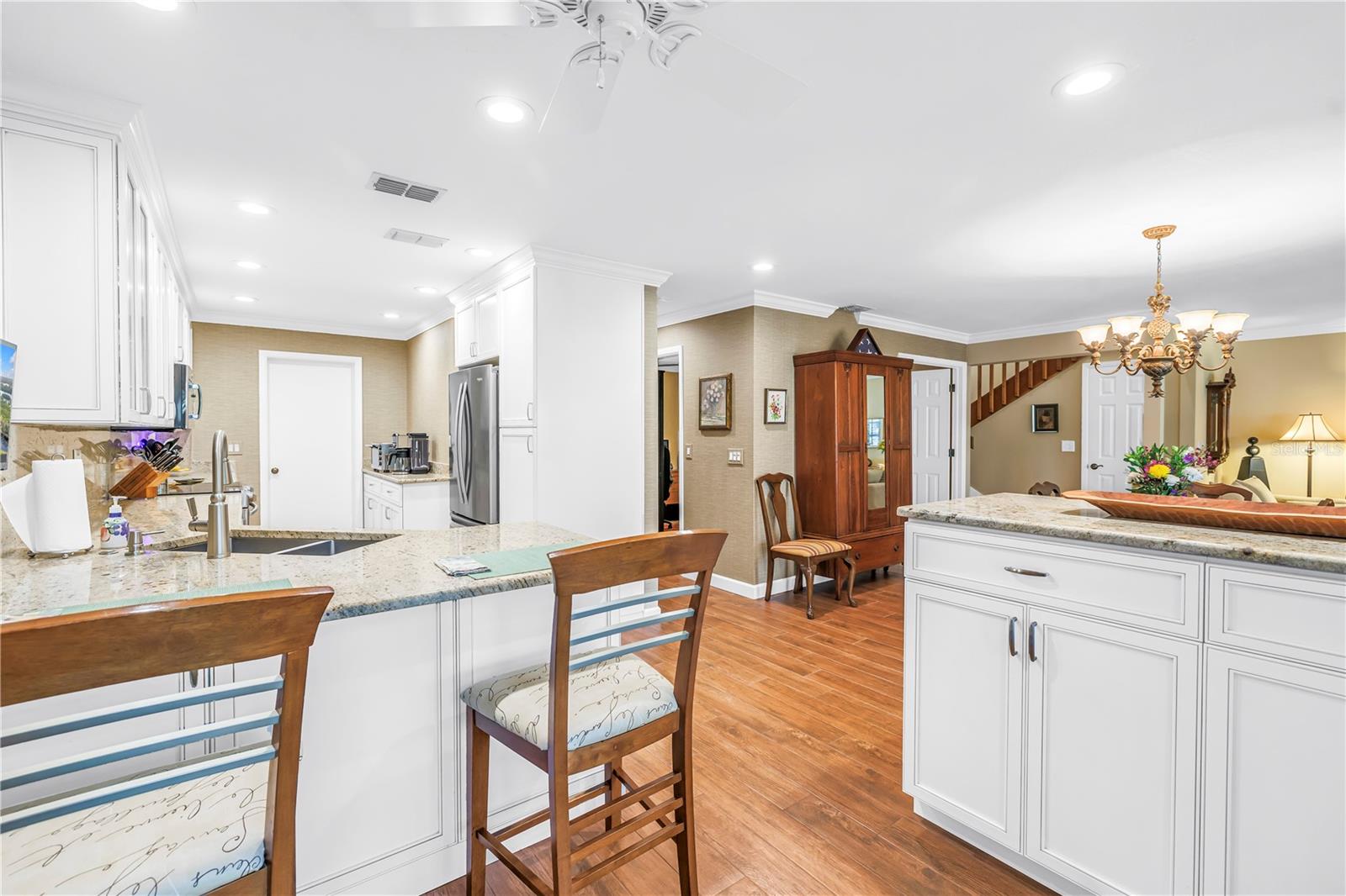 Peninsula with pull out Shelves for serving and the Open Floor Plan to entertain.