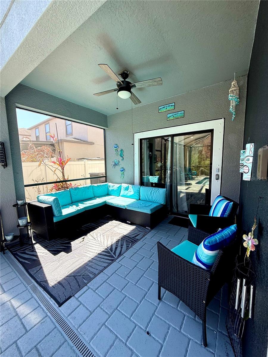 Covered seating area by swimming pool