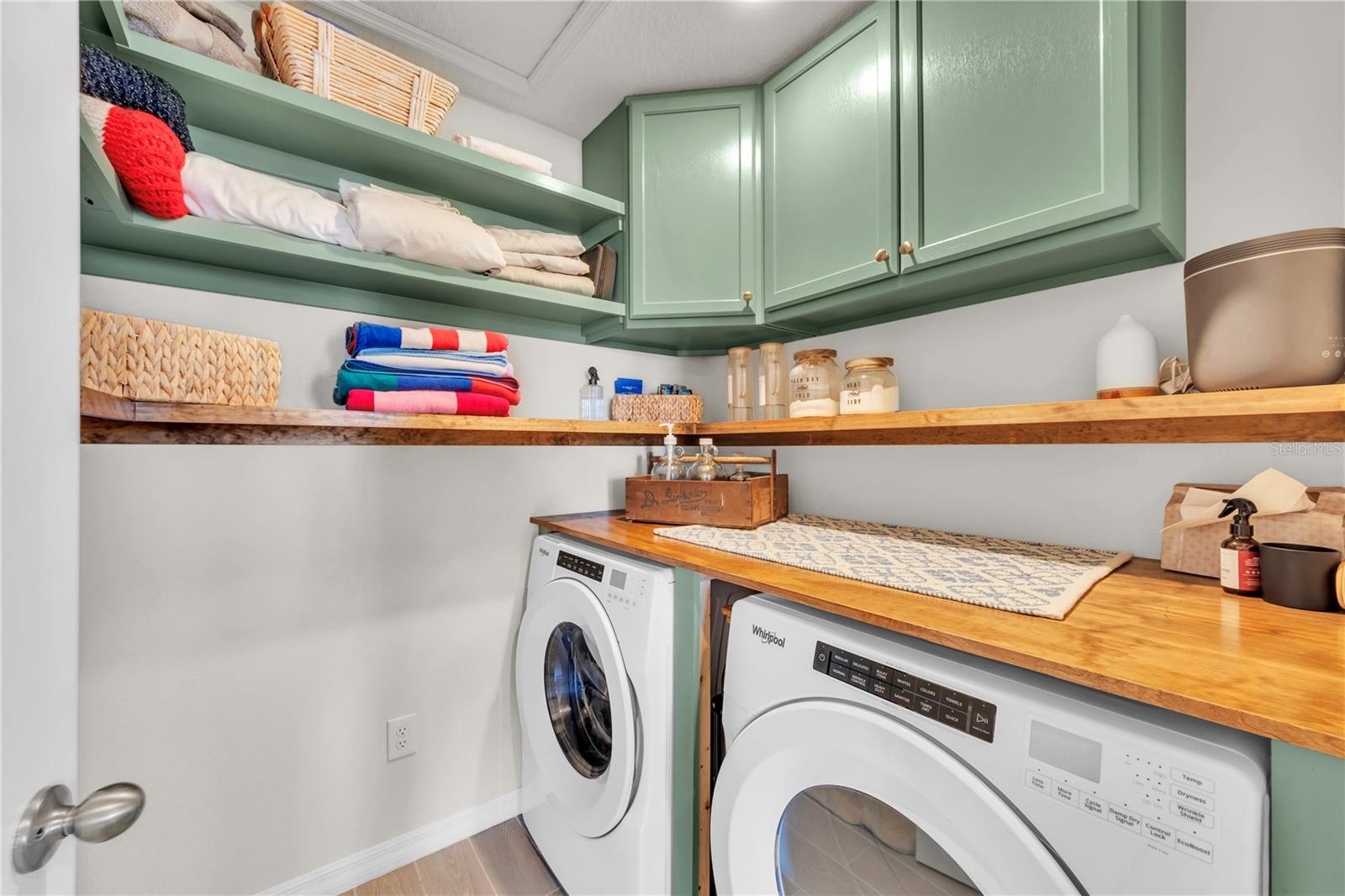 Upstairs laundry with EVEN more organization space.  I know it's going to get messy but the owners have provided you OPTIONS now on where to hide stuff.
