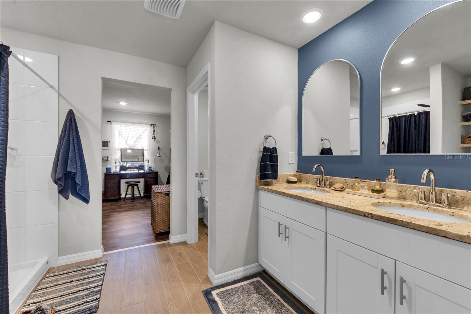 Master bathroom area with dual vanity.