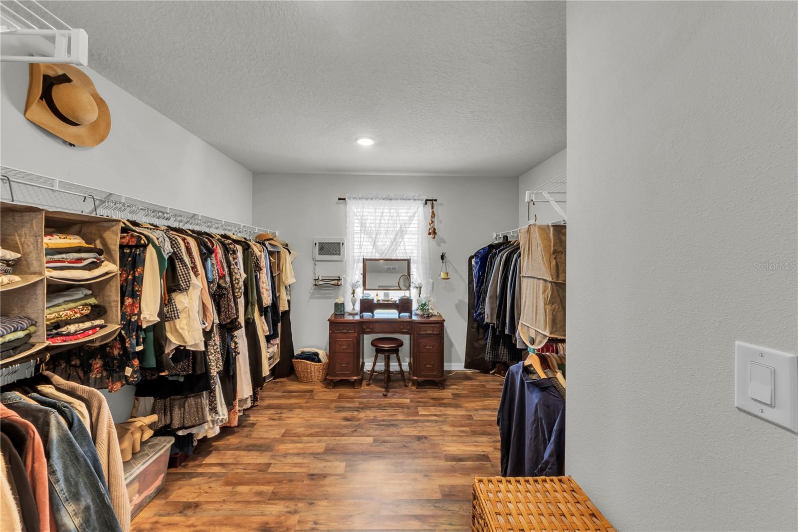 I would say this is a walk in closet but that would be insulting to it's sheer size.  You could park a JET SKI in this closet and still have room to spare.