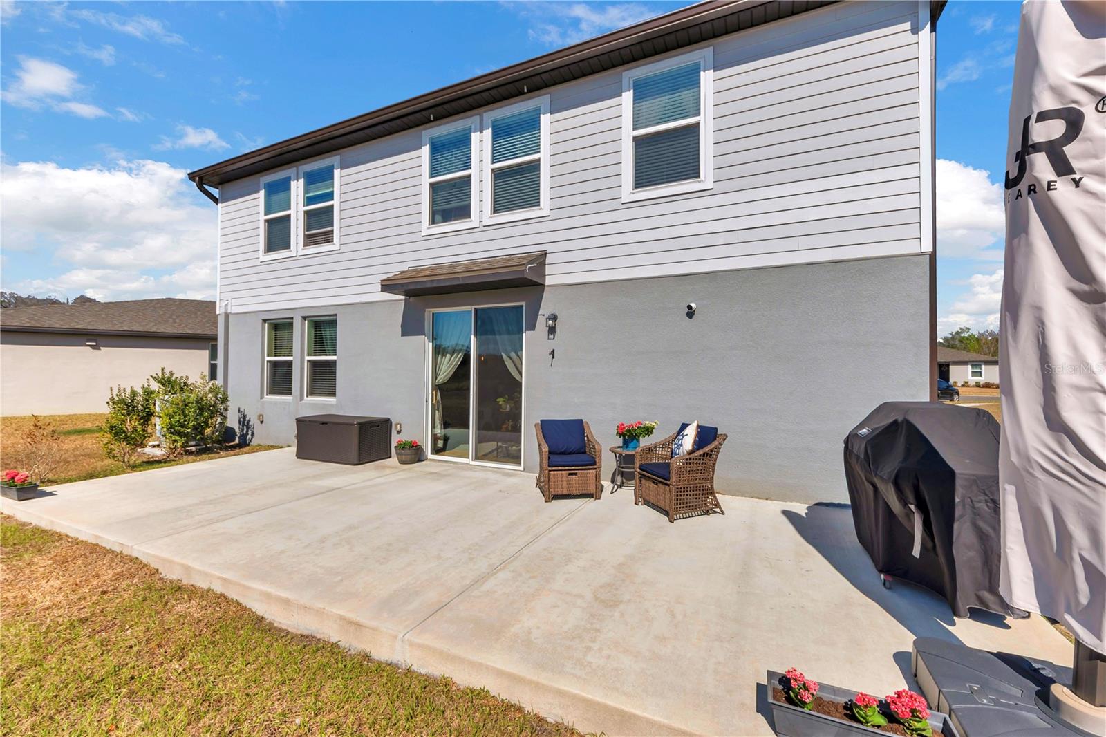 Big concrete paved outdoor area which was added by the owners.