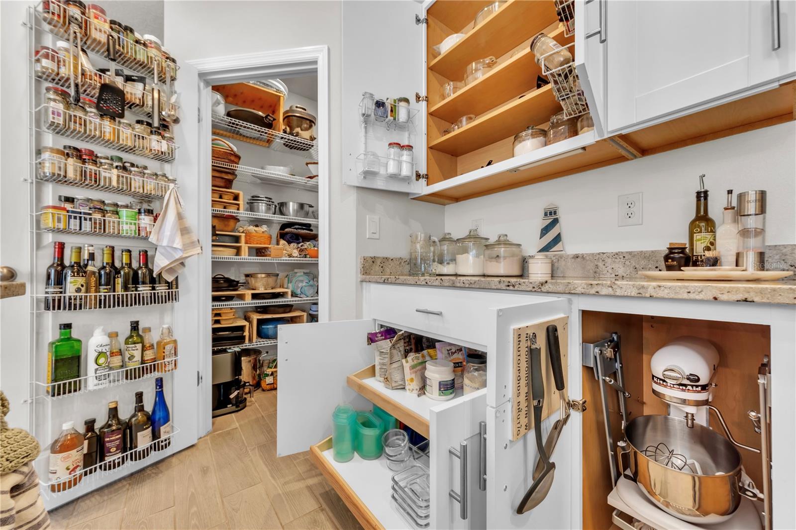 Storage anyone?  This home features more storage than you will know what to do with.  It even has in the right corner a pull out MIXER DRAWER.