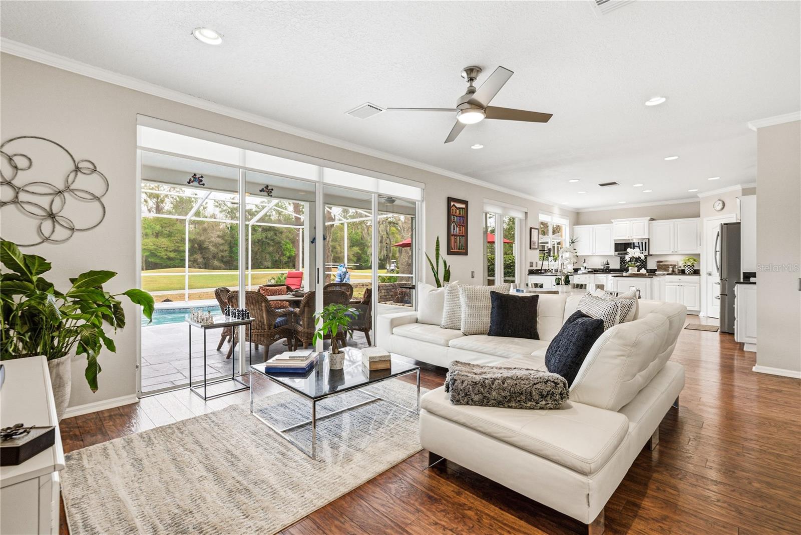 Family Room with Large Triple Slider to Lanai, Pool and Golf Course