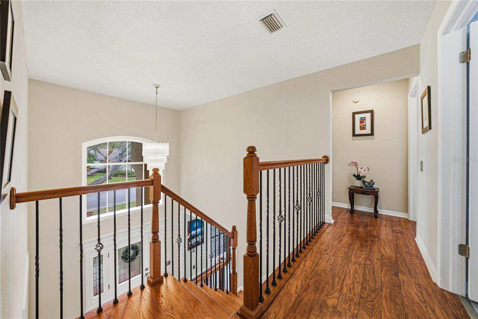 Solid Wood and Iron Staircase with Laminate Floor Hallways