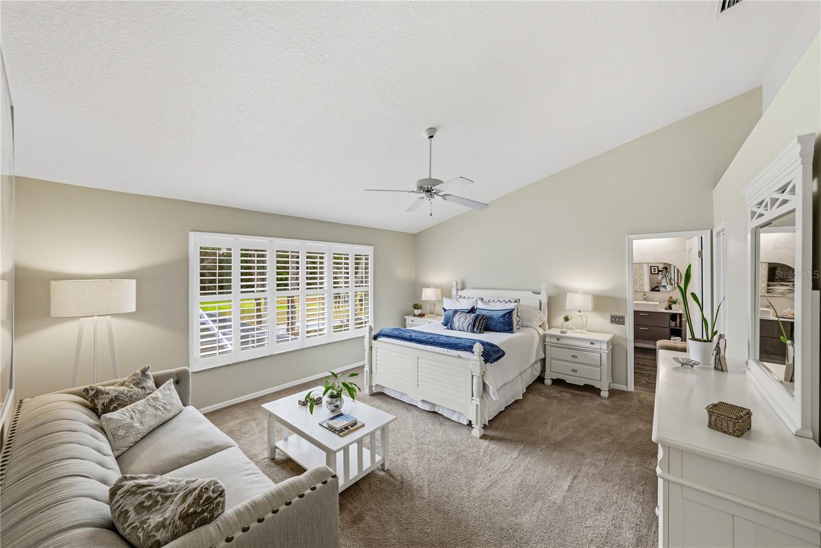 Primary Suite with Large Sitting Area and Views to Golf Course