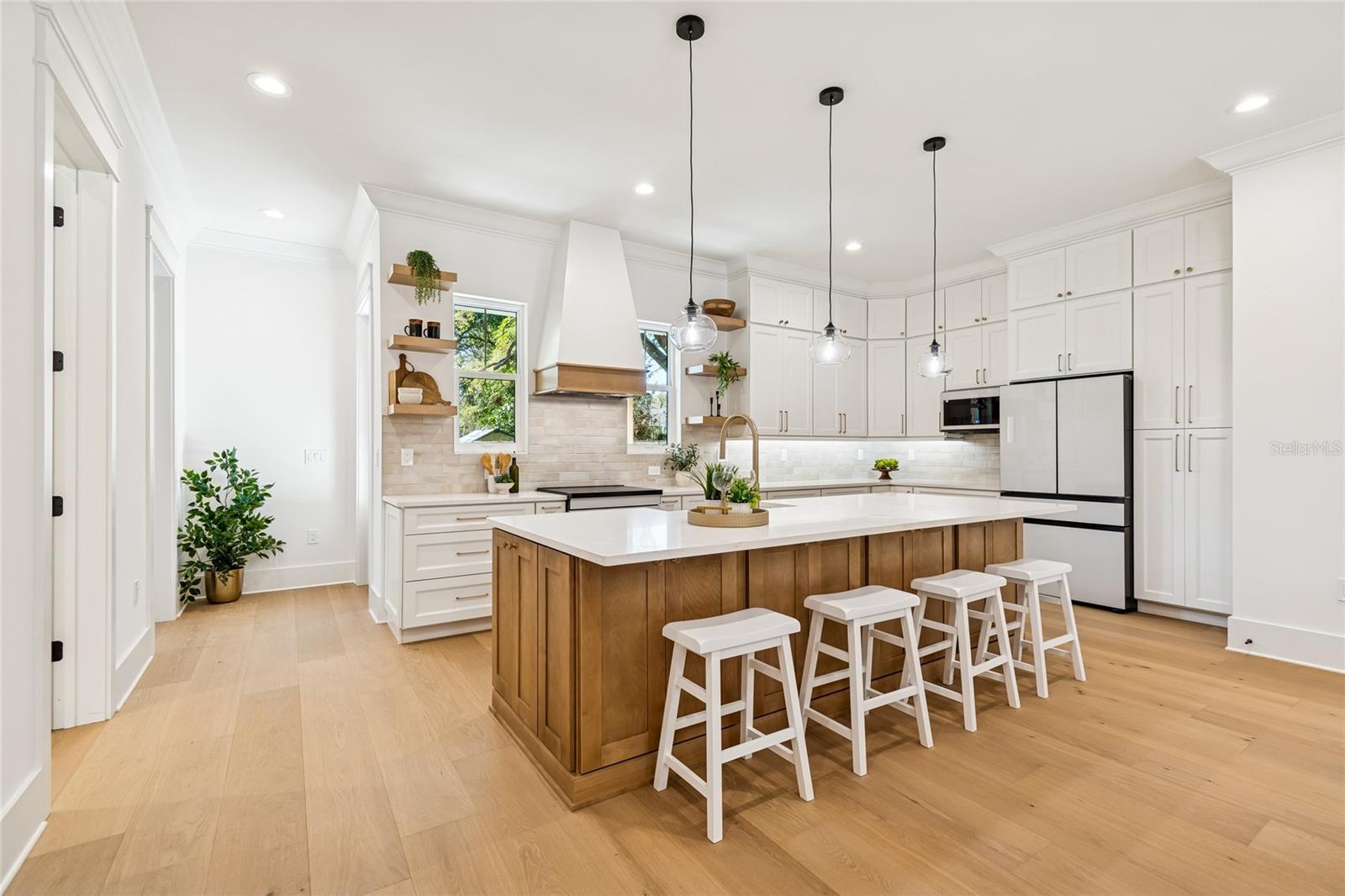 Chef's Delight! Love the open shelves, tiled backsplash and under cabinet lighting!