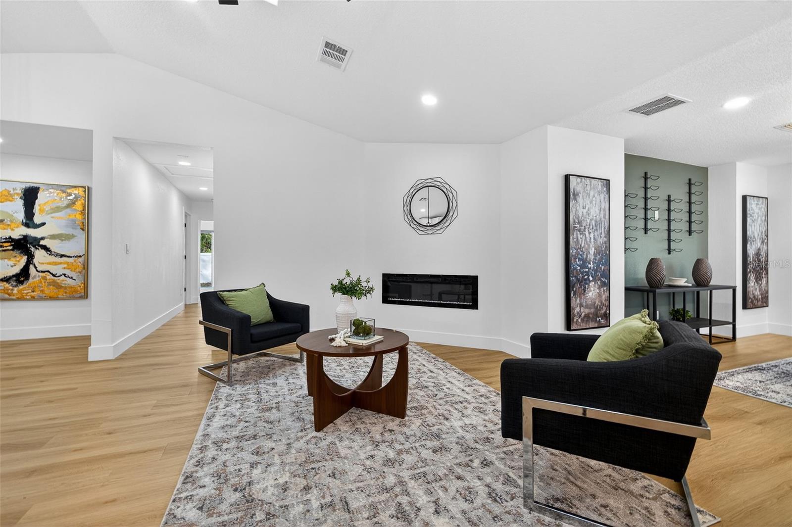 Bright, open living space with VAULTED ceilings and natural light.