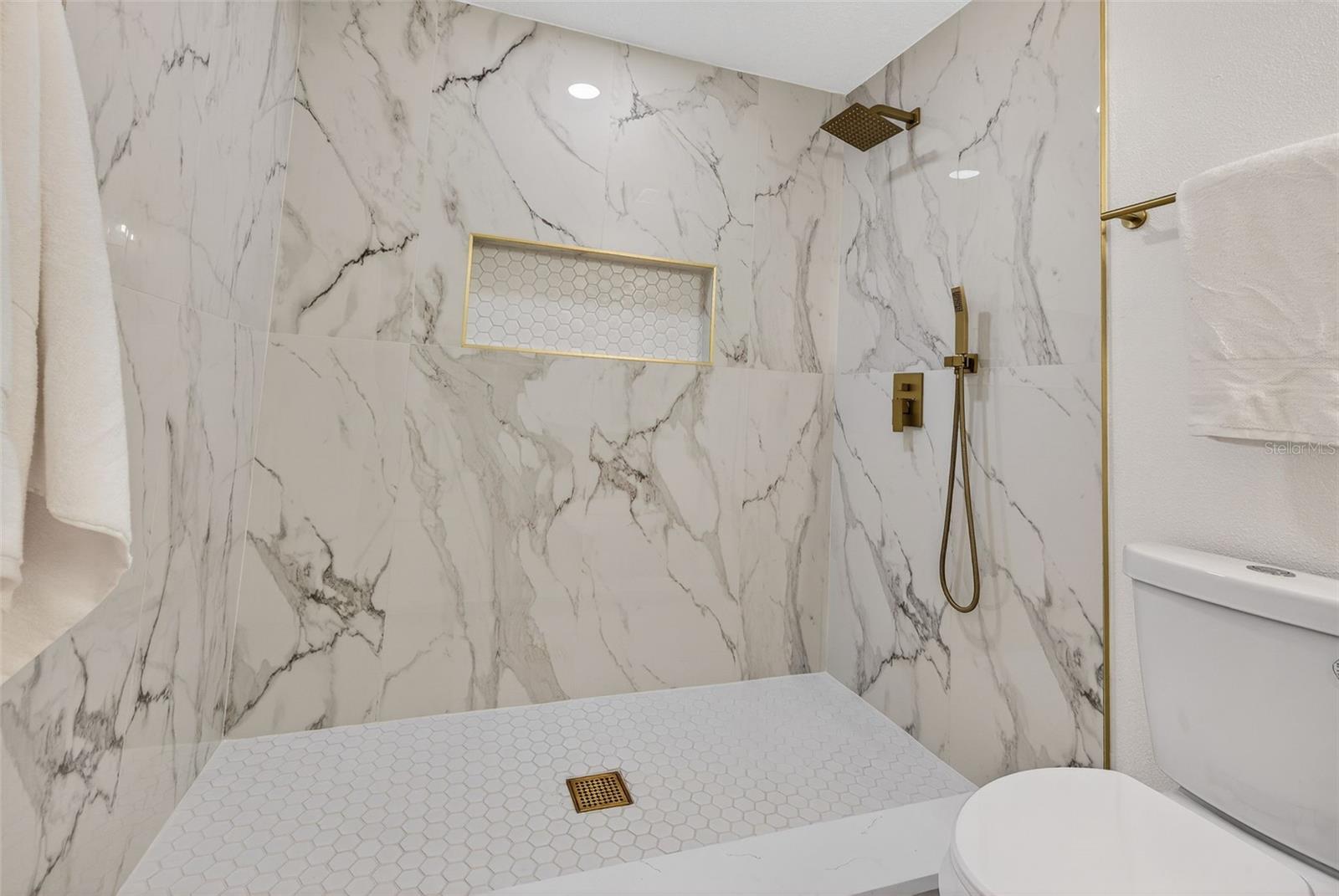 Spa-inspired primary bath with custom WALK-IN TILE SHOWER