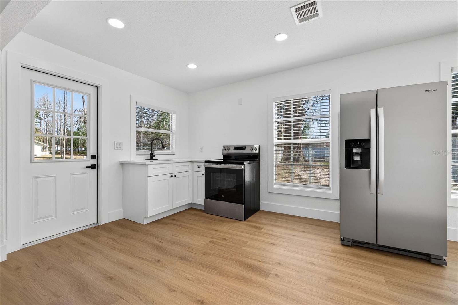 Updated with new cabinetry, appliances, and finishes