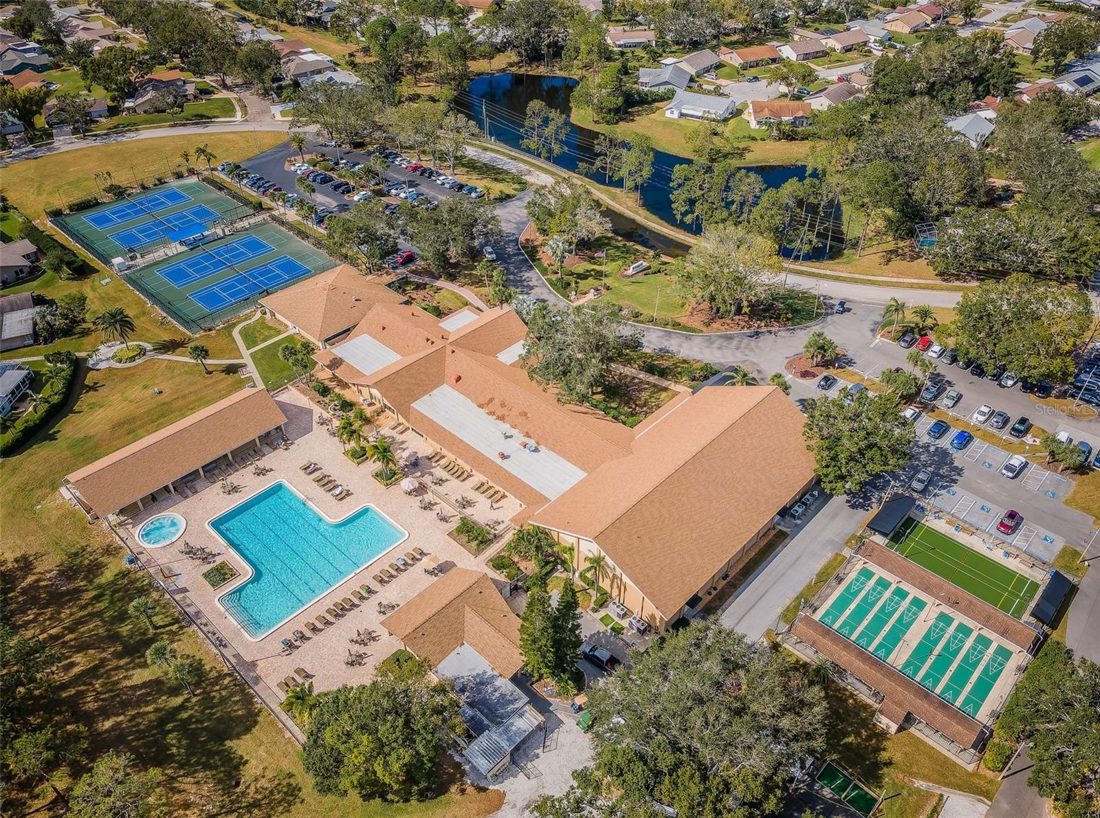 Aerial view of Clubhouse, main pool and sports courts