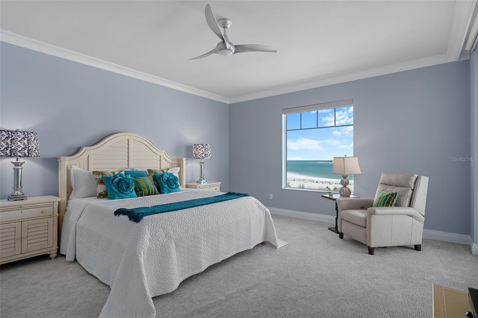Awake to peaceful coastal views through the windows and sliding glass doors.