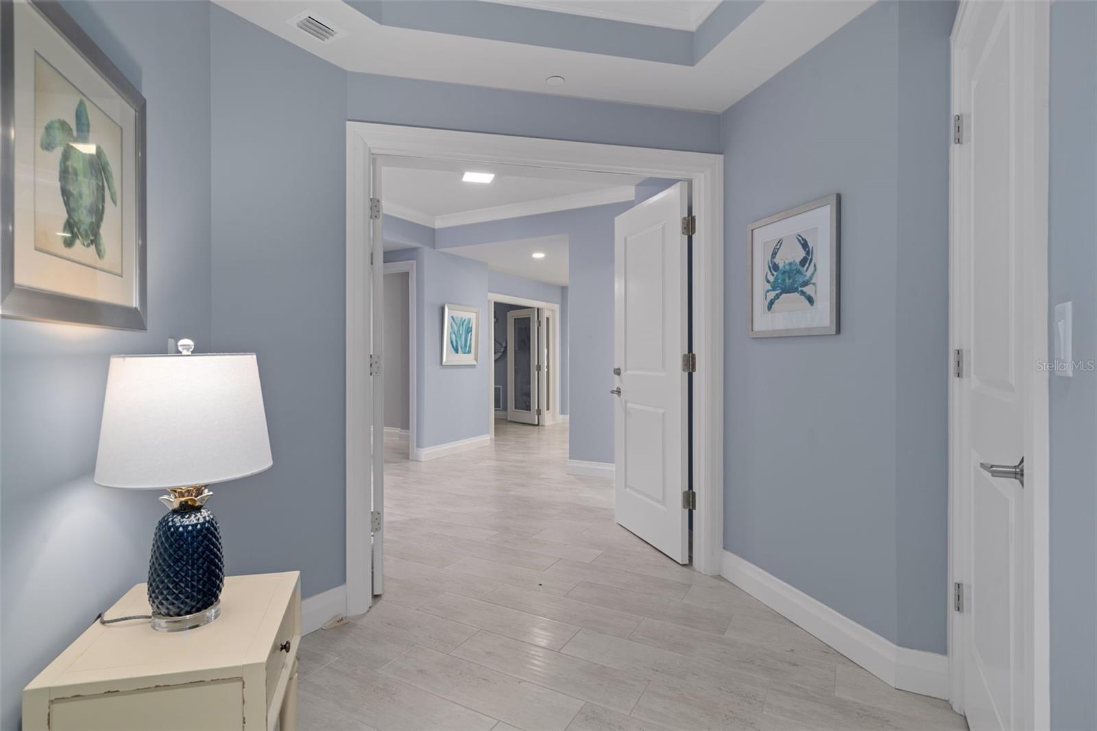 Step into paradise as the elevator doors open into your private foyer, providing seamless access from the secure garage to your exclusive condo.