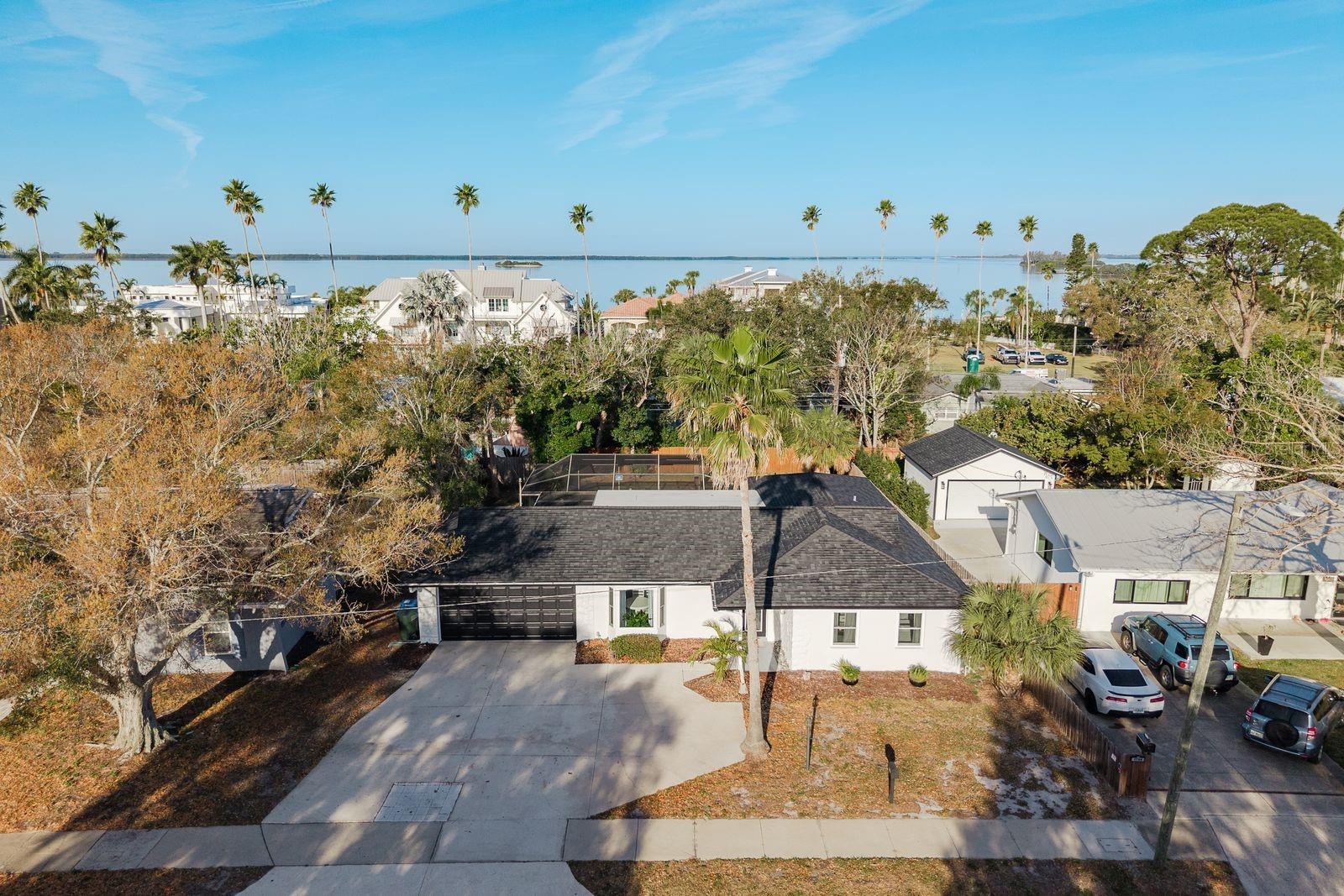 Nestled amongst the palms. Large driveway with two car garage!