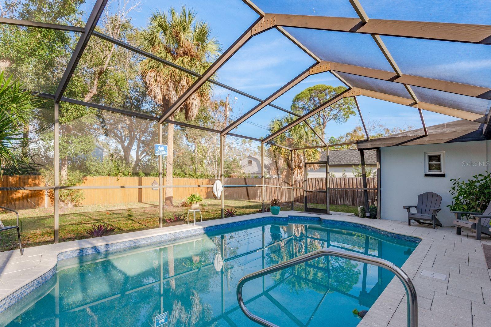 Recently updated in ground swimming pool with a fenced in back yard.