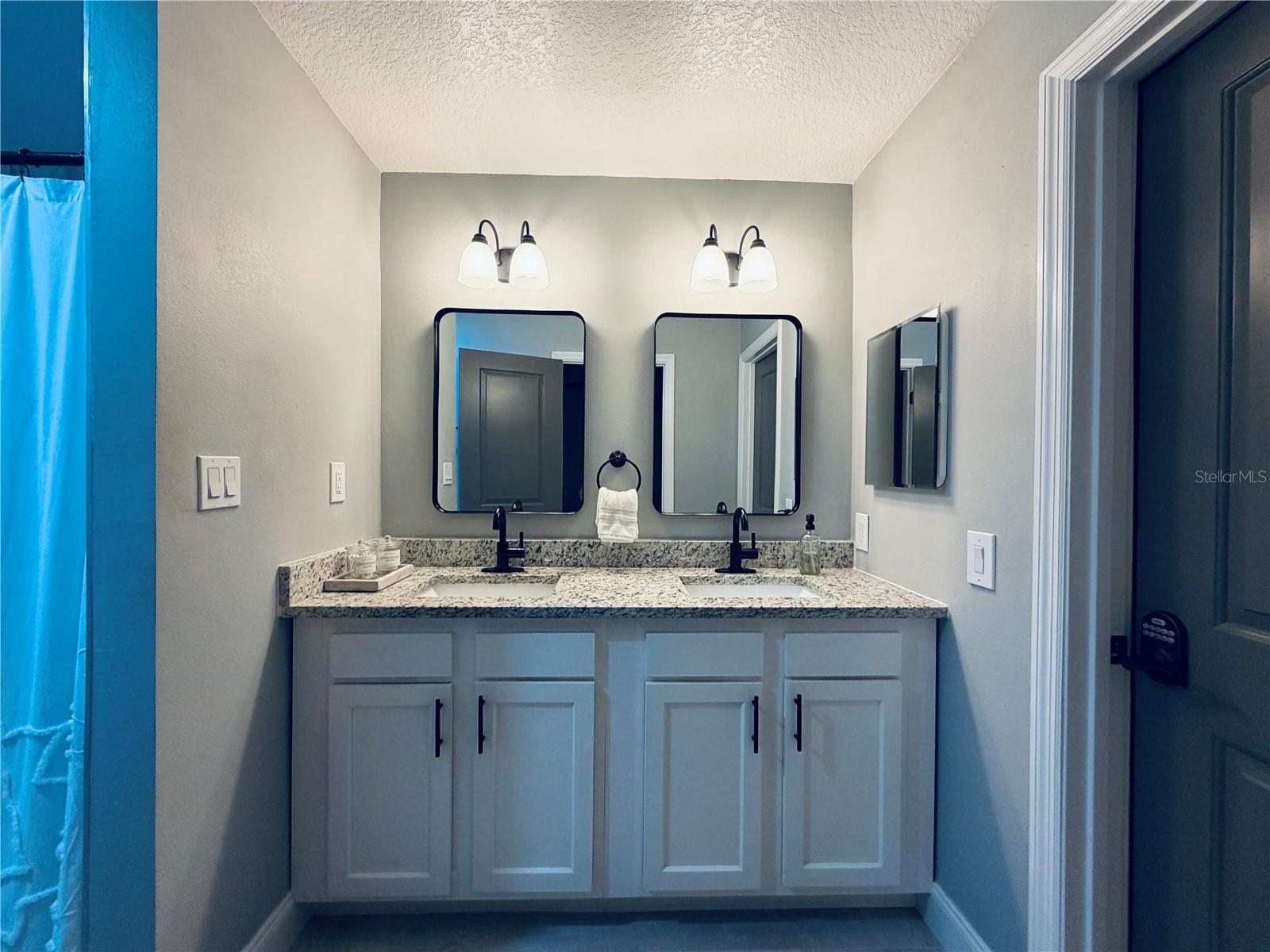Primary Bathroom double vanity with walk in closet