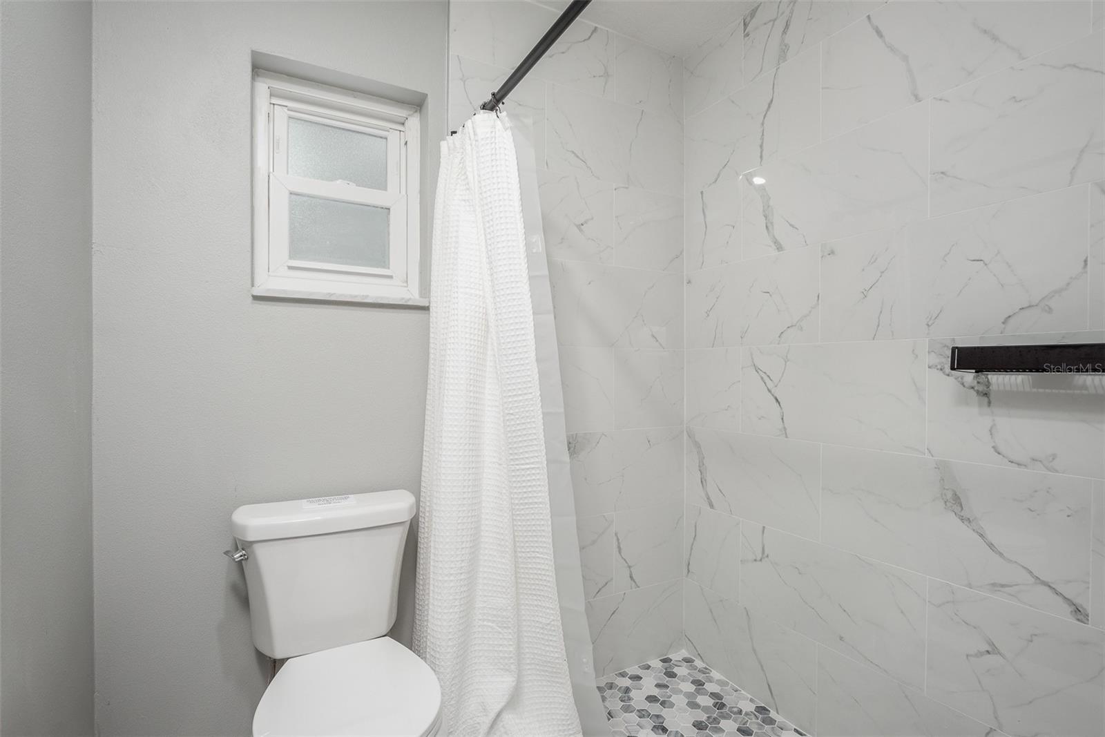 Primary bathroom walk in shower.