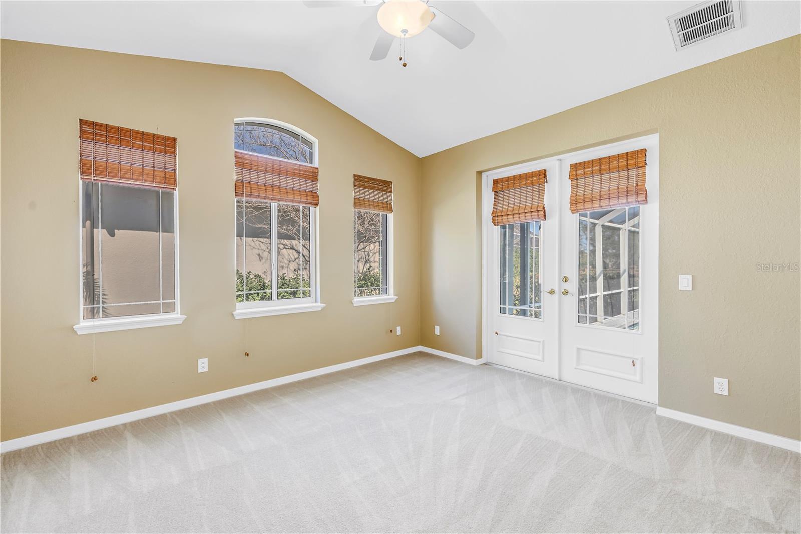 Bedroom 2 with access to the pool & outdoor space