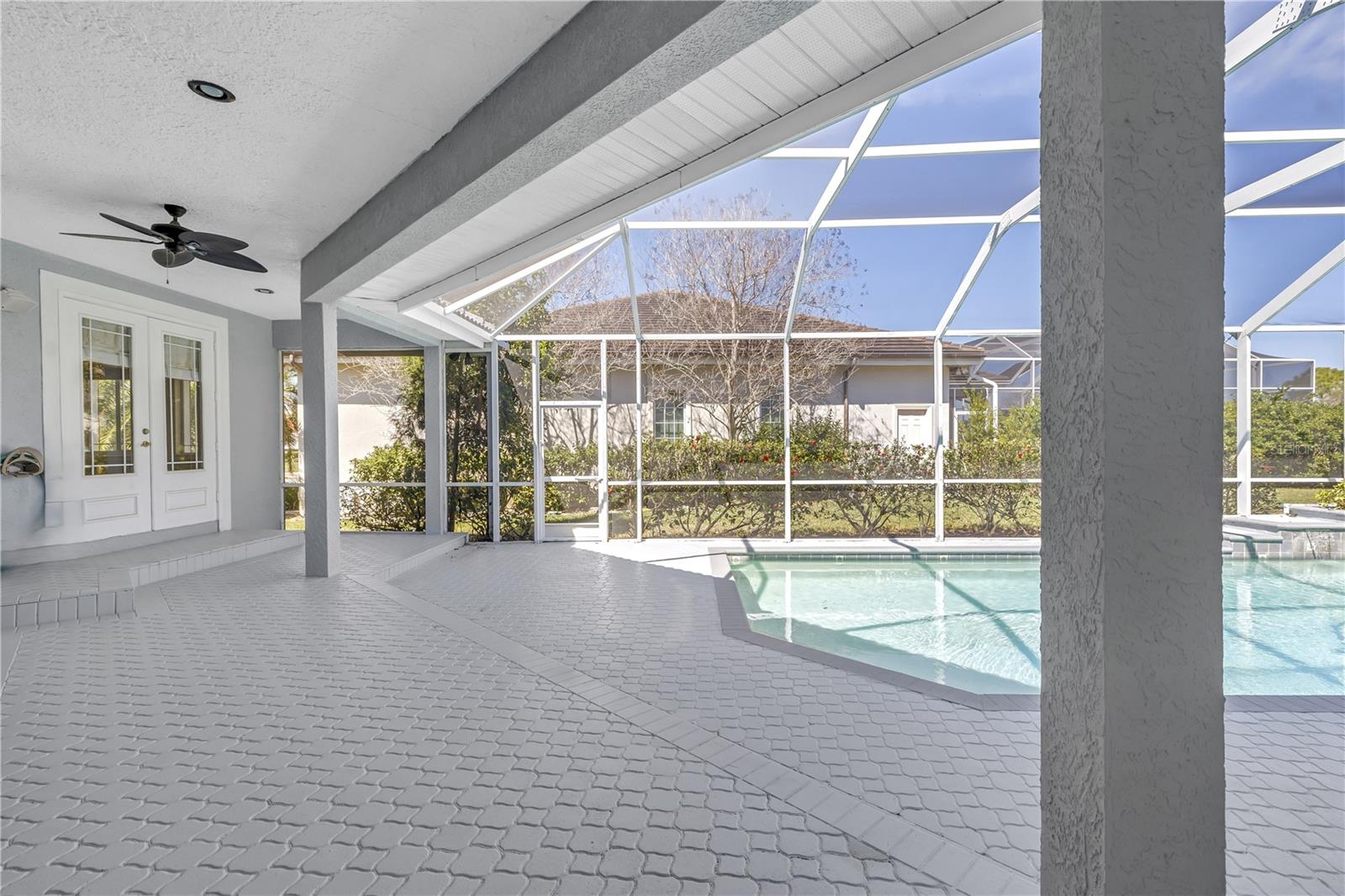 Covered outdoor space overlooking the pool
