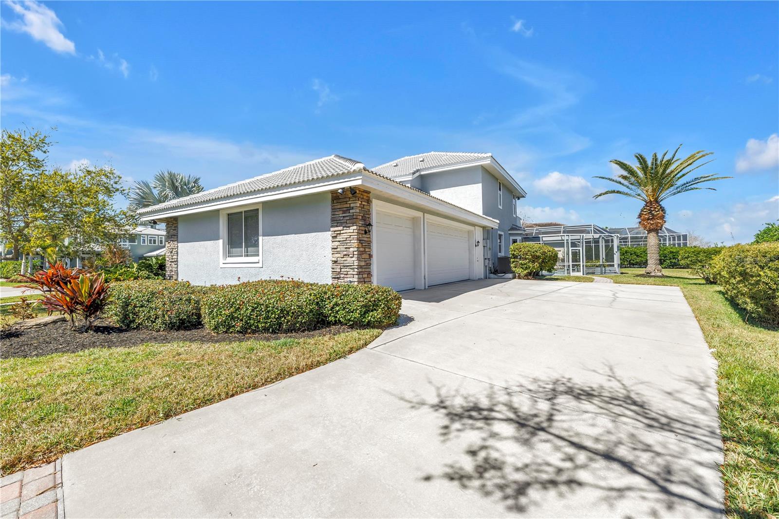 Long driveway leads to 3 car garage