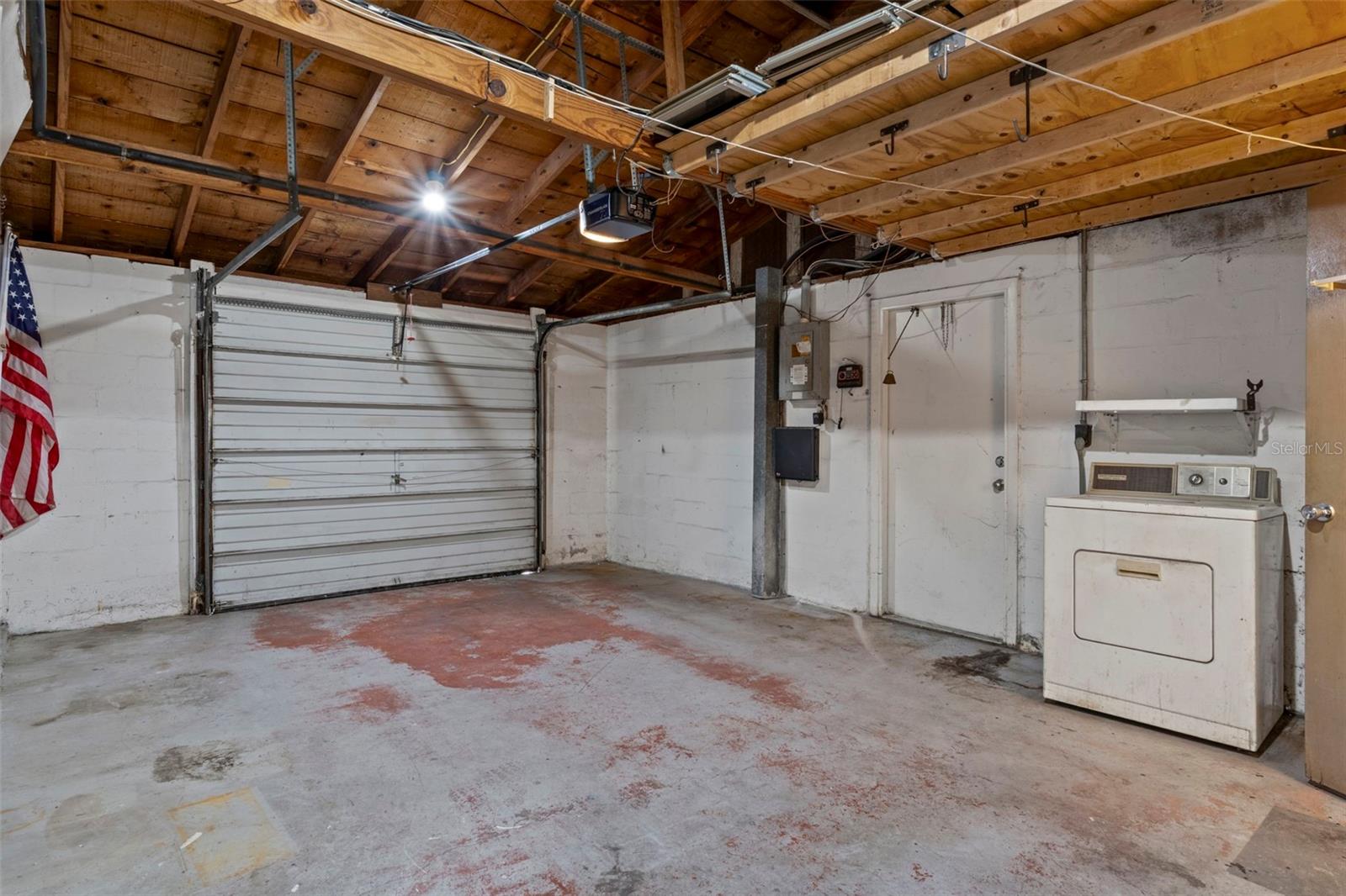 Over Sized One Car Garage with a garage door opener