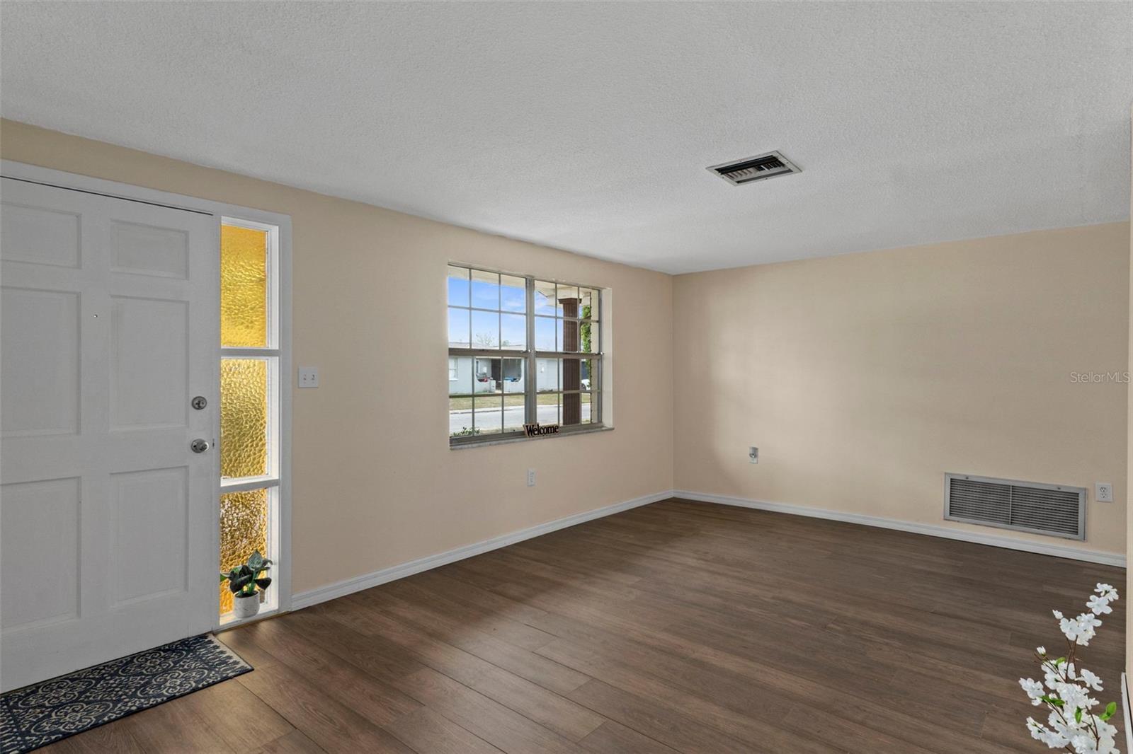 Notice the gorgeous laminate wood flooring installed throughout the entire in Feb. 2026