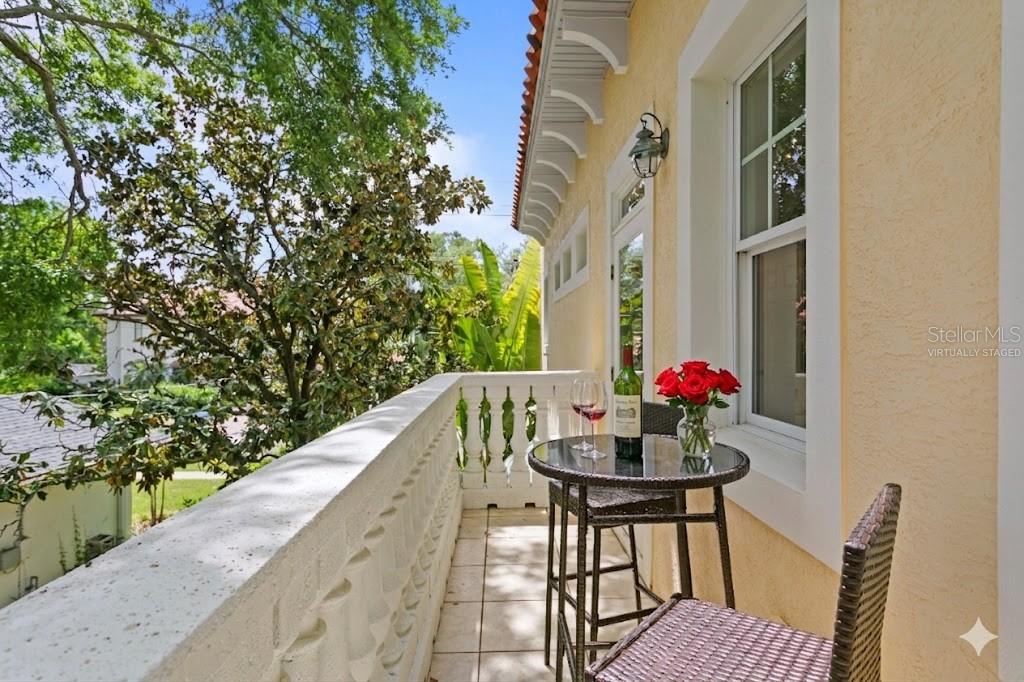 Virtually staged private terrace off primary suite