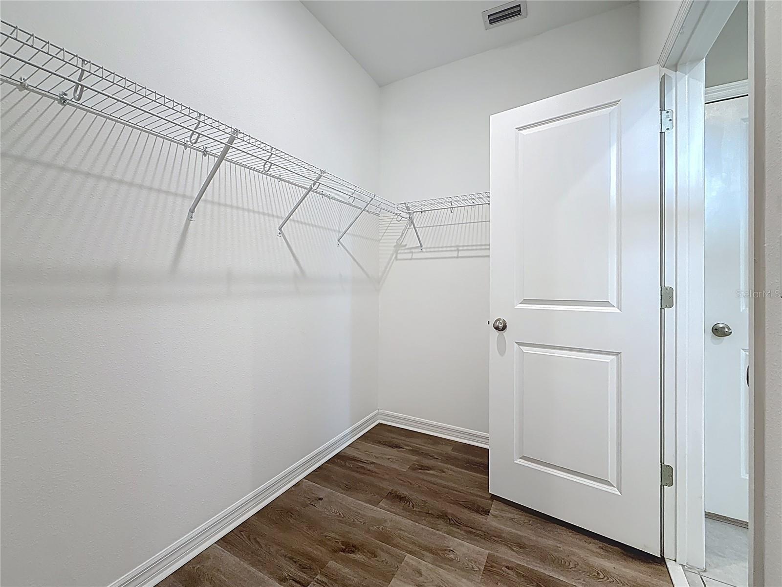 Walk in closet primary bedroom