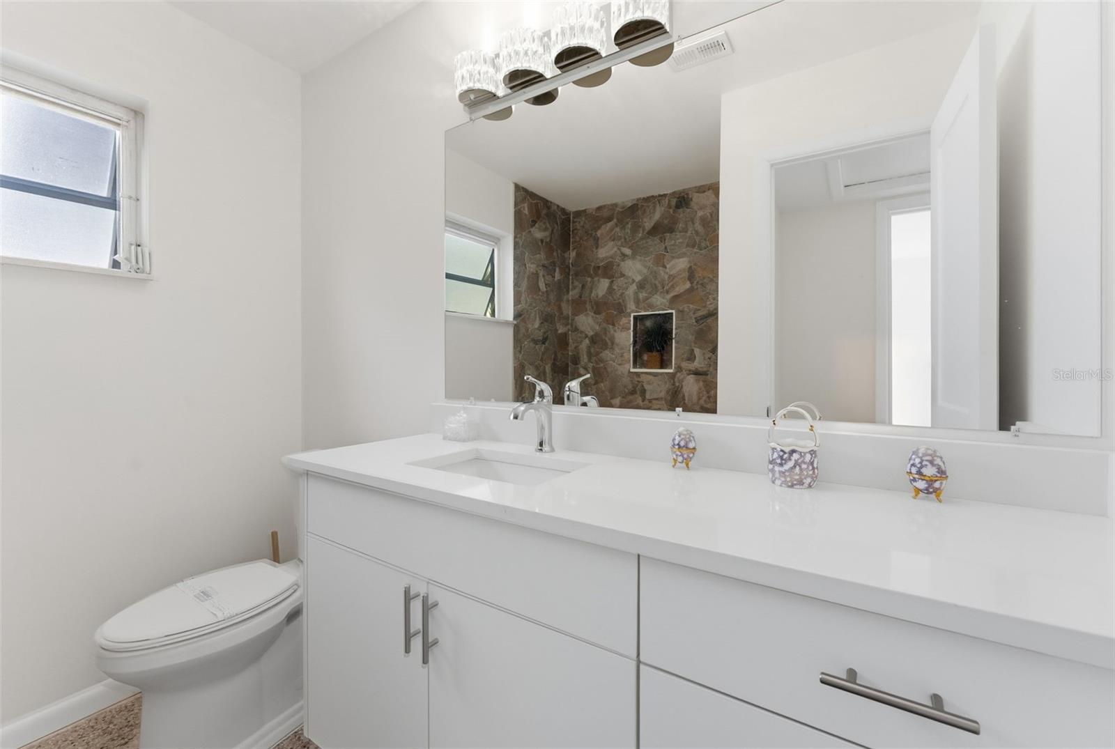 Hall bath with Shower / Tub combo and new stone