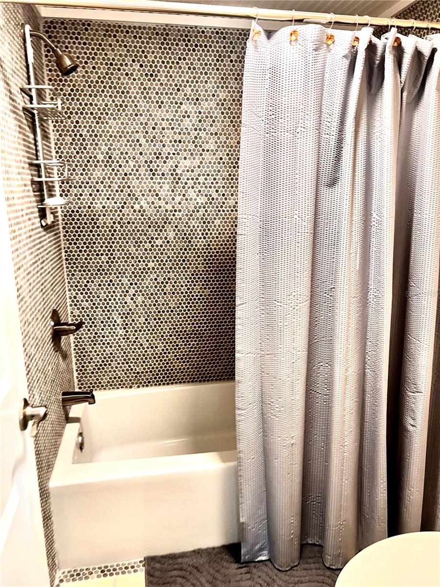 Primary Bathroom with new updated shower tiles.