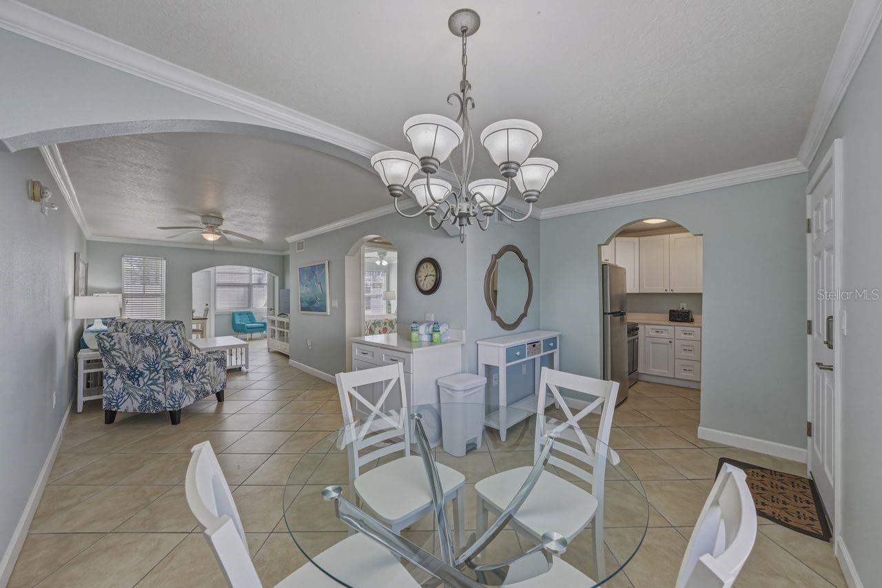 View of living room from the dining room. Furnished as seen