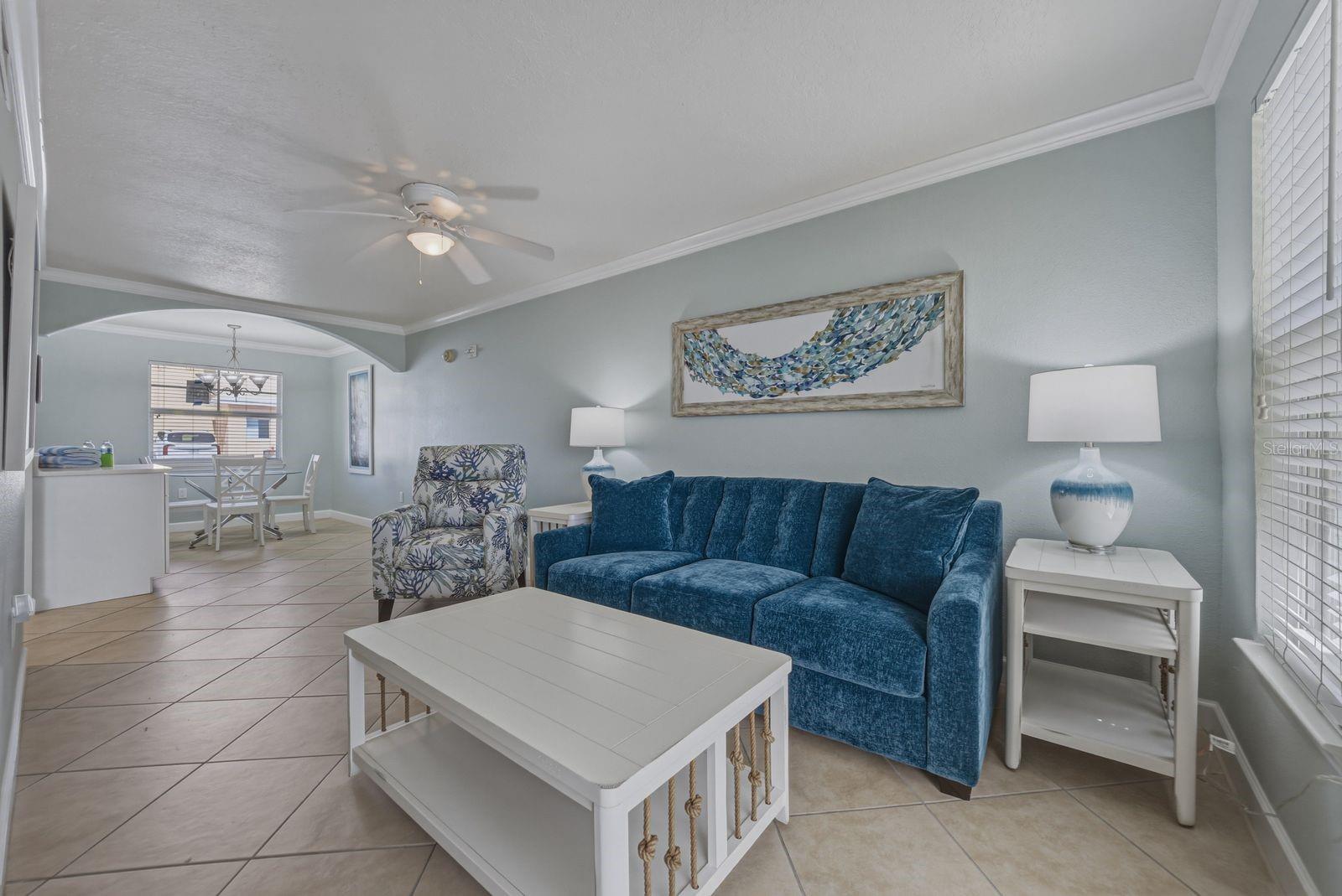View of living room from the sun room. Furnished as seen