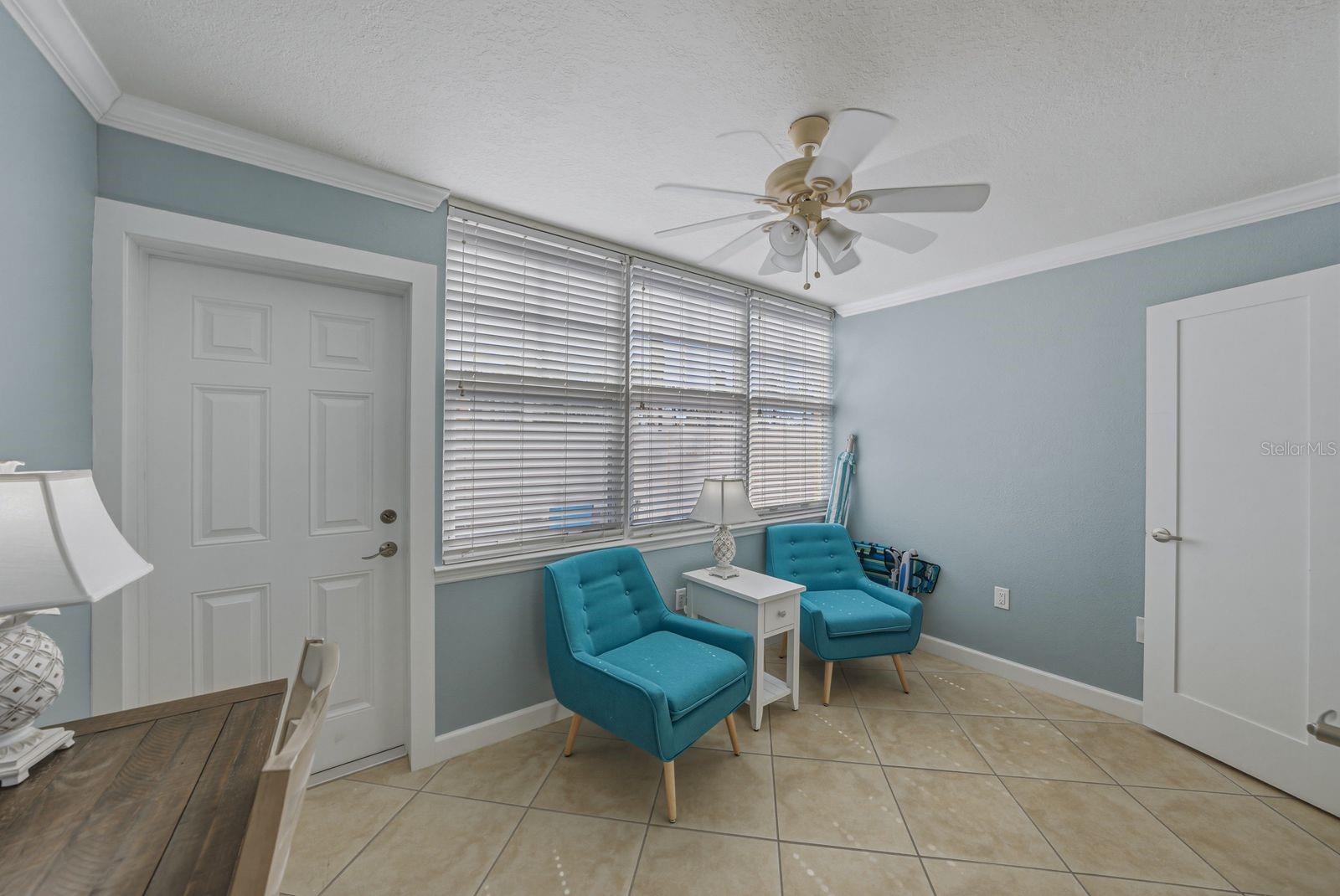 Sun room with door to back lanai. Furnished as seen.