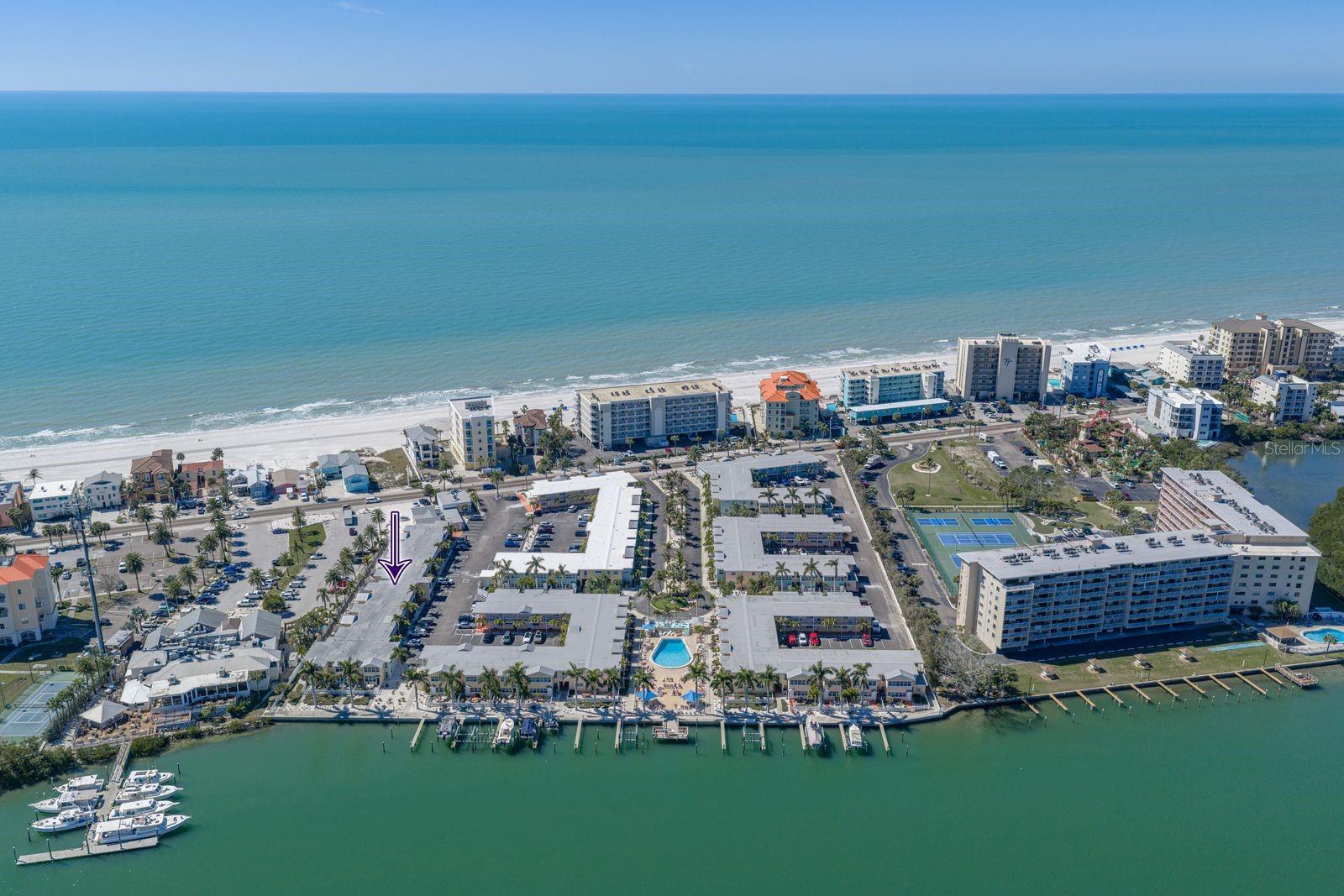 Barefoot beach resort is nestled between the intercoastal waterway and the Gulf of America. Purple arrow is location of your new condo.