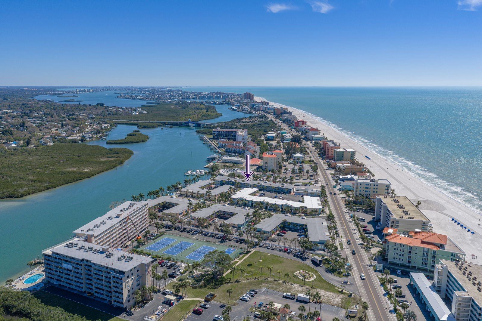 Indian shores is a barrier island. Purple arrow points at your new condo.